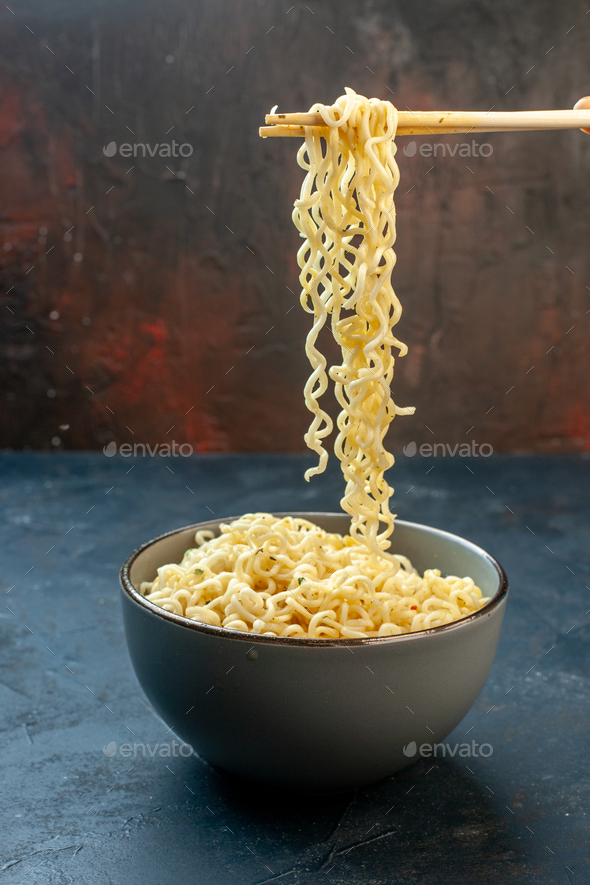 Front View Hashi Chopsticks Asian Ramen Noodles In Bowl On Dark